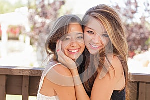 Two Mixed Race Girlfriends Pose for Portrait Outdoors
