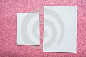 Two mockup paper blanks on pink background