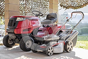 Two models of lawnmower red and silve