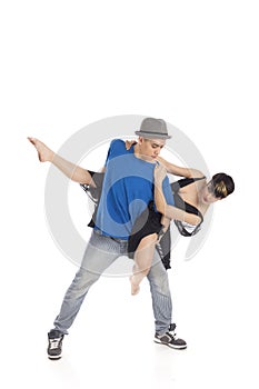 Two modern ballet dancers in dynamic action figure, on white background