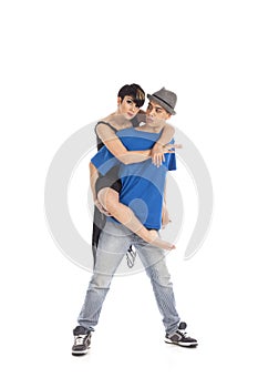 Two modern ballet dancers in dynamic action figure, on white background