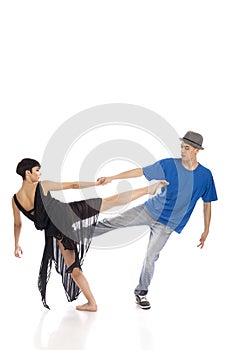 Two modern ballet dancers in dynamic action figure, on white background