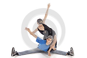 Two modern ballet dancers posing in studio.