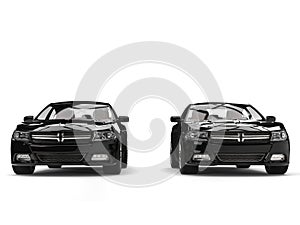 Two modern black fast cars - side by side