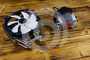 Two modern CPU coolers on wooden desk