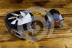 Two modern CPU coolers on wooden desk