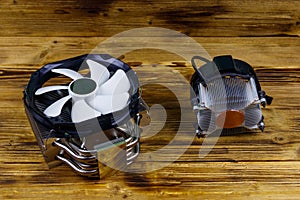 Two modern CPU coolers on wooden desk