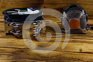 Two modern CPU coolers on wooden desk