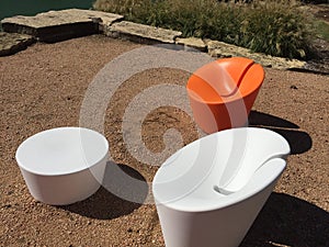 Two modern design chairs and table in a park