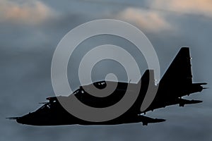 Two modern military jet fighters in clouds