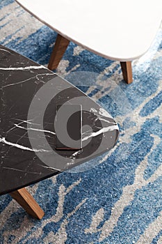 Two modern stool made of black and white artificial stone