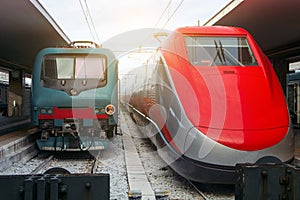 Two modern train engines in a train station