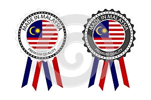 Two modern vector Made in Malaysia labels isolated on white background, simple stickers in Malaysian colors