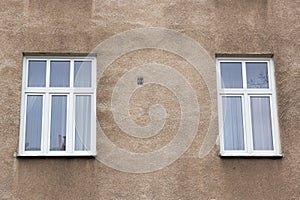 Two modern windows on the facade of the house