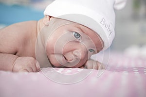 Two month old baby boy portrait on bed