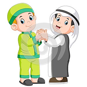 Two moslem man and his best friend shaking hands photo