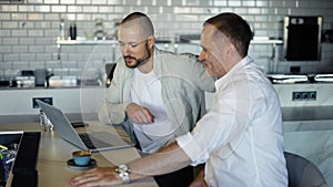 Two motivated businessmen are discussing a project during lunch. Take a break from work. Modern world providence