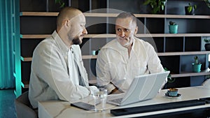 Two motivated businessmen are discussing a project during lunch. Take a break from work. Modern world providence