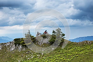 Two motor cross riders on top of the mountain