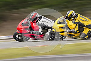 Two motorcycle on track