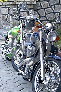 Two motorcycles parked next to each other