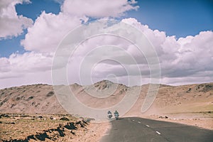 two motorcyclists on mountain road in Indian Himalayas,