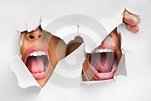 Two mouths screaming from hole in wall