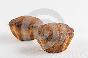 Two muffins with chocolate on a white background, isolated