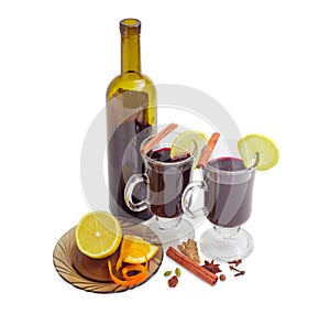 Two mugs with mulled wine, bottle of wine, mulling spices