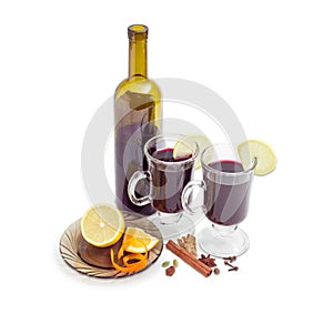 Two mugs with mulled wine, bottle of wine, mulling spices