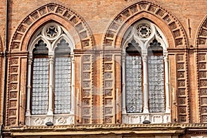 Two Mullioned windows - Accursio Palace in Bologna Italy photo