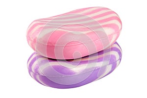 Two multi-colored striped soaps isolated on white background
