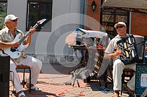 Two musicians playing in the street