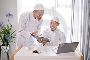 muslim business partner discussing and meeting using laptop