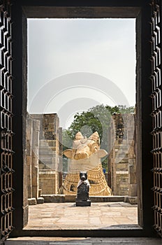 The two Nandi statues seen from inside Gangaikunda Temple.