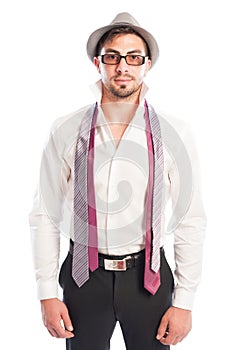 Two neckties hanging on male model wearing glasses and hat