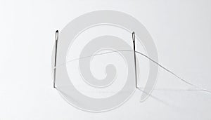 Two Needles Linked by a Single Thread