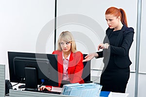 Two nervous colleague worker in office with computer