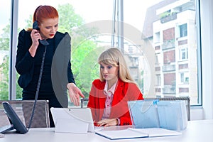 Two nervous colleague worker in office with computer