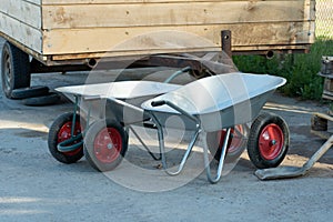 Two new hand wheelbarrows on a construction site