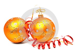 Two New Year's spheres of orange color and red tinsel