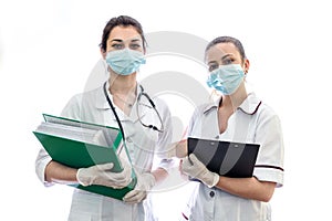 Two nurses holding documents isolated on white
