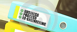 Two office folders with text BUSINESS PROCESS RE ENGINEEERING