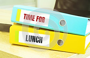 Two office folders with text time for lunch