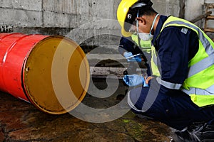 Two Officers of Environmental Engineering wearing masks inspected Oil Spill