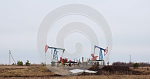 two oil derricks pump oil