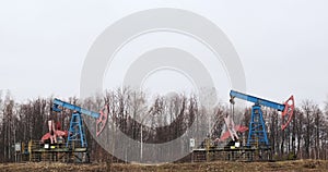 two oil derricks pump oil