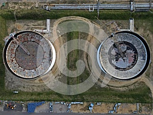 Two oil storage tanks connected top down aerial
