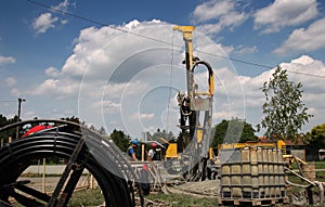 Two Oil Workers Working on Drilling Rig