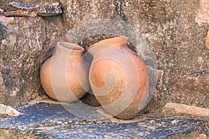 Two old amphoras in castle of Pena de la Encina photo